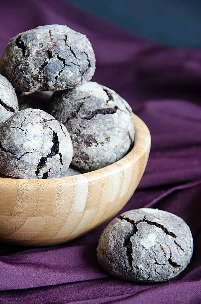 istock Cracked chocolate biscuits in wooden bowl 530496894