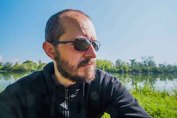 istock Bearded and mustache man with sun glasses in nature 530497126