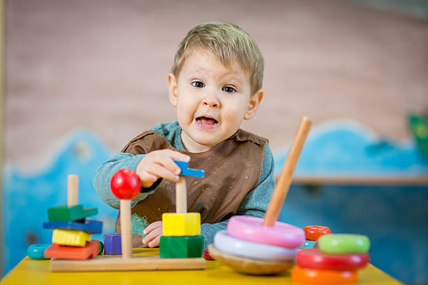 istock Little caucasian boy playing in pre-school 530501460