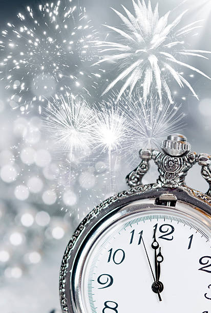 istock Vintageclock with fireworks and holiday lights 530502221