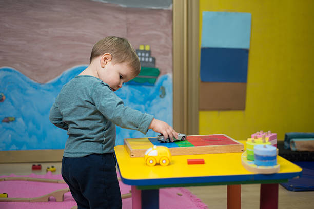 istock Little boy with Montessori material 530502598