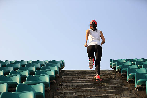istock Runner athlete running on stairs. 530503404