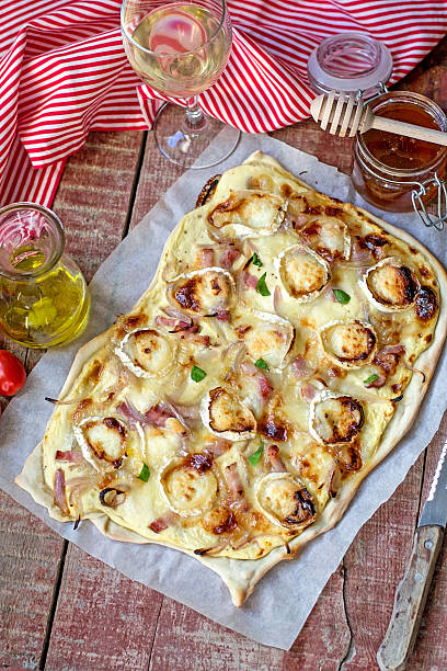 French traditional dish tarte flambee Flammekueche with goat cheese