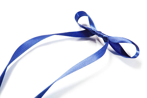 istock Blue fabric ribbon and bow on white background 530503869