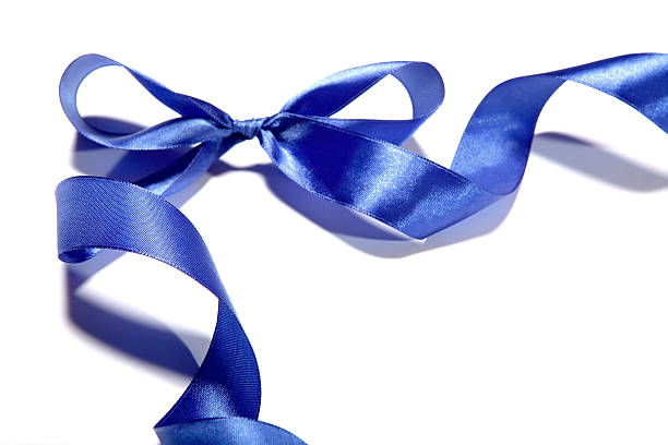 istock Blue fabric ribbon and bow on white background 530503921