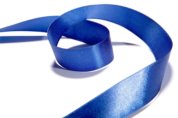 istock Blue fabric ribbon and bow on white background 530504041