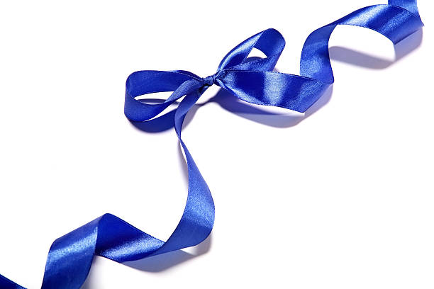 istock Blue fabric ribbon and bow on white background 530504119