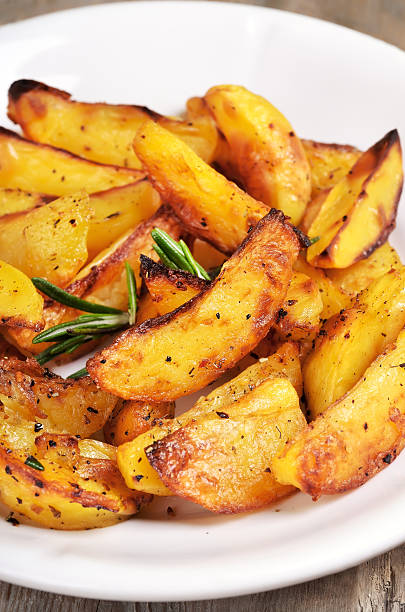 istock Fried potato wedges on white plate 530504795