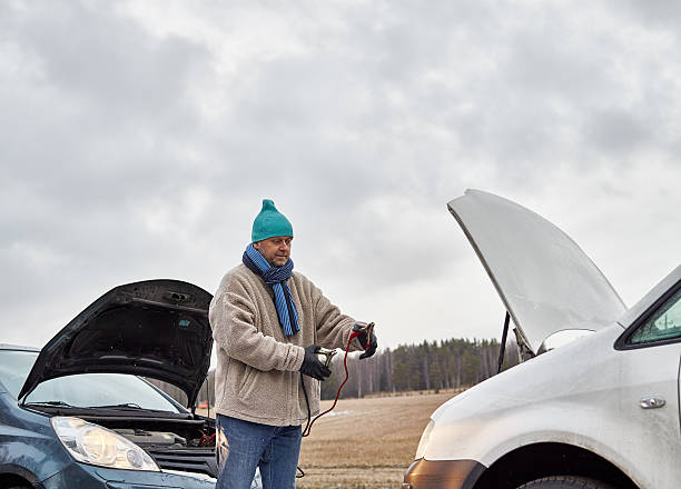 Male and jumper cables stock photo