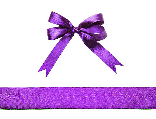 istock Magenta (purple)fabric ribbon and bow isolated on a white background 530506169