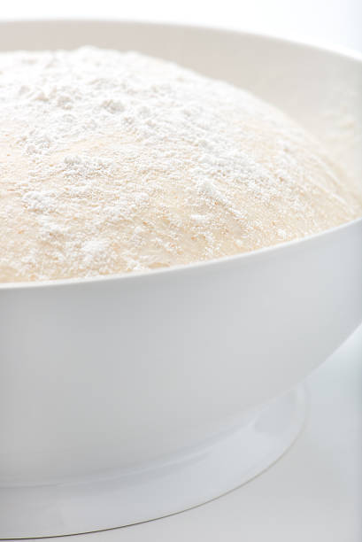 istock handmade pizza or bread dough in a white bowl 530506753