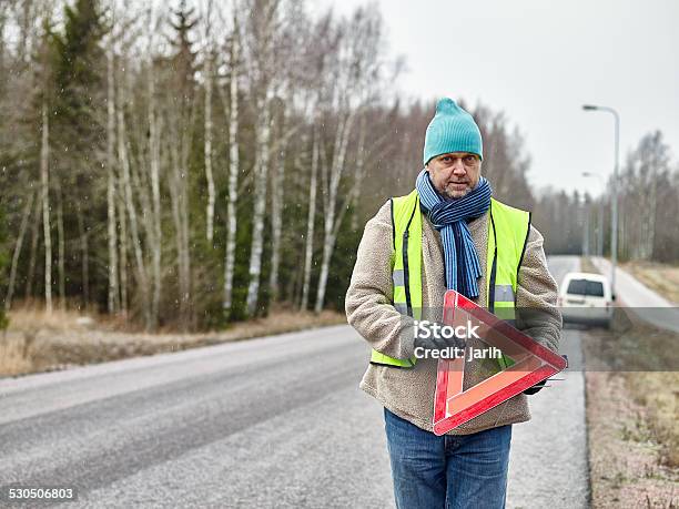 Male And Warning Triangle Stock Photo - Download Image Now - Knit Hat, Men, Only Men