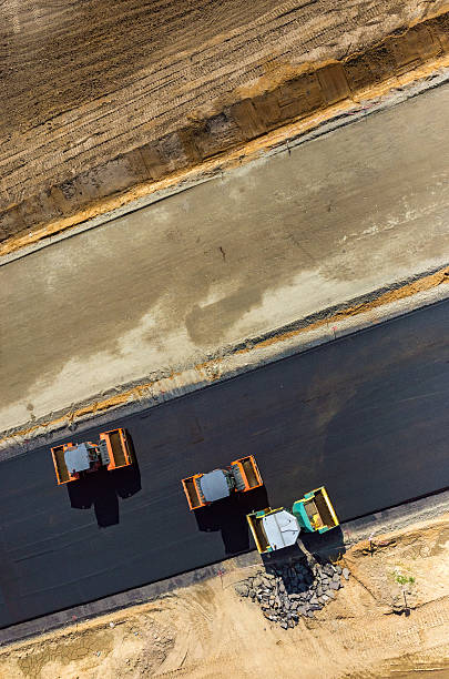istock Road rollers working on the construction site aerial view 530507180