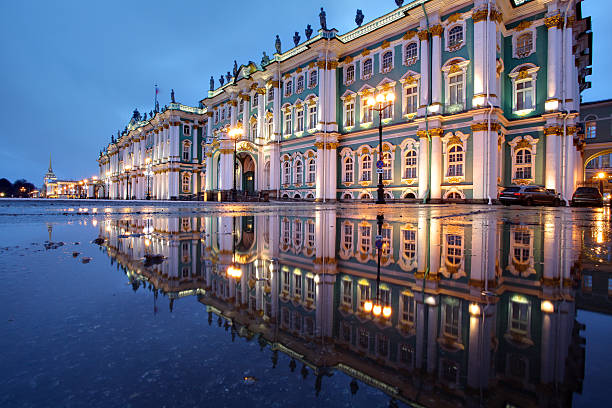 russia, st. petersburg, hermitage buildings reflected in water, evening. - ermitaget bildbanksfoton och bilder