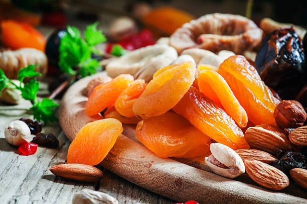 istock Dried apricots, dates, raisins and various nuts 530508434
