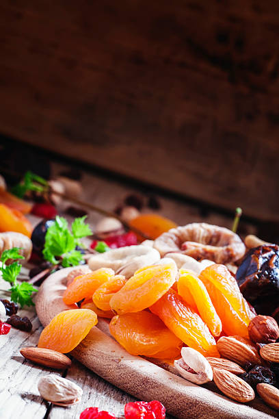 istock Dried apricots, dates, raisins and various nuts 530508498