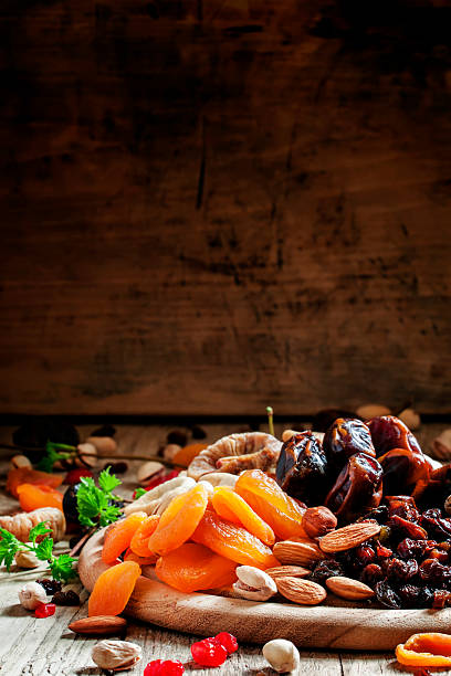 istock Dried apricots, dates, raisins and various nuts 530508548