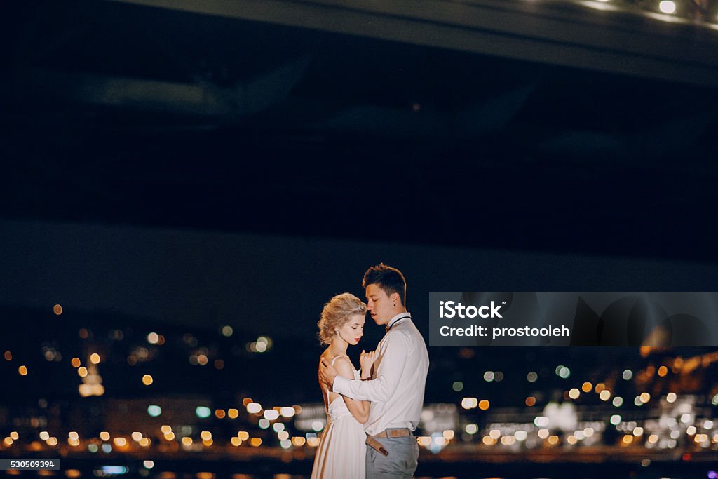 wedding day in Budapest gorgeous wedding couple walking in Budapest at night Adult Stock Photo