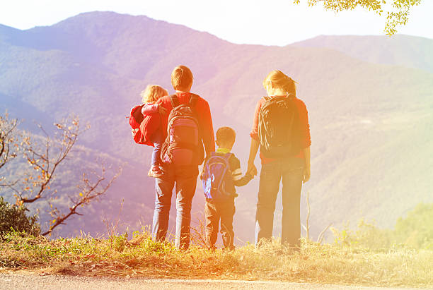 istock family with two kids hiking in mountains 530510084