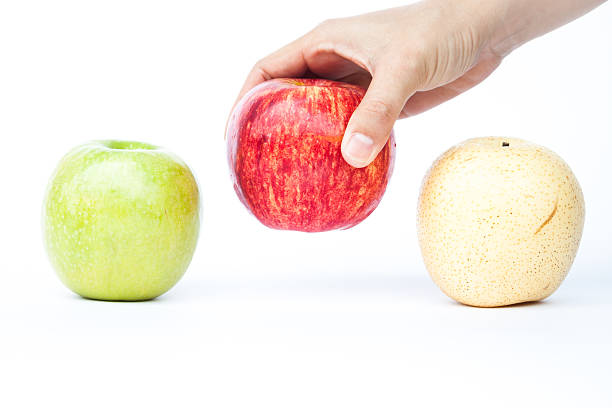 istock Three different kind of apples on white background 530510766