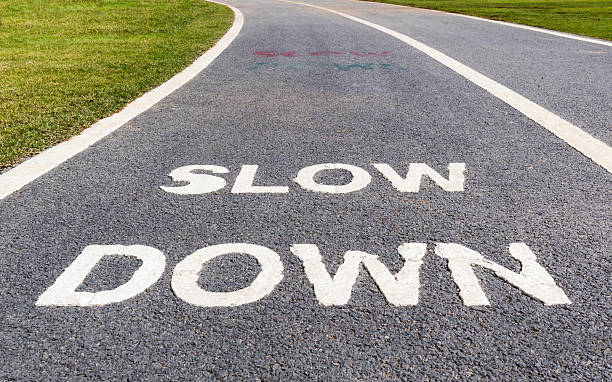 istock The warning sign to slow down marked on street. 530511948