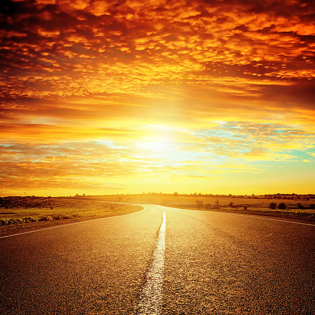istock good red sunset and asphalt road to horizon 530518105