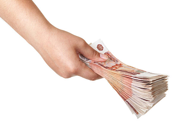 istock Stack of five thousandth bills in the female hand. 530518913