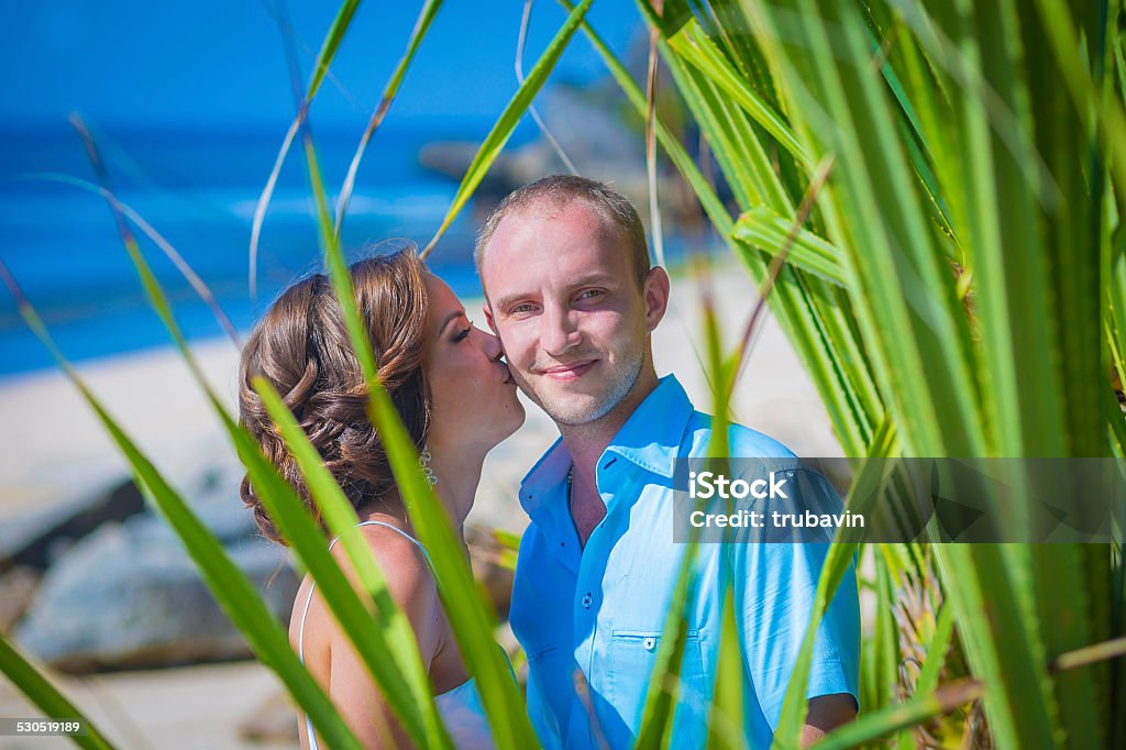 Loving Wedding Couple on Ocean Coastline Loving Wedding Couple on Ocean Coastline.Bali.Indonesia Adult Stock Photo