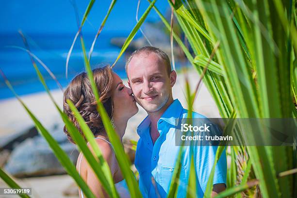 Loving Wedding Couple On Ocean Coastline Stock Photo - Download Image Now - Adult, Adults Only, Bali