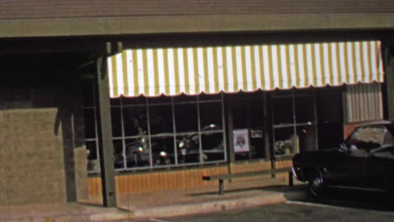 1974: Fifth Avenue Florists building front public facing open store.