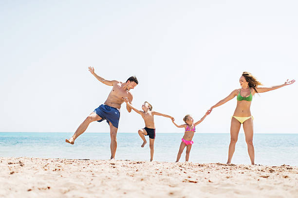istock Playful family on the beach. 530522399