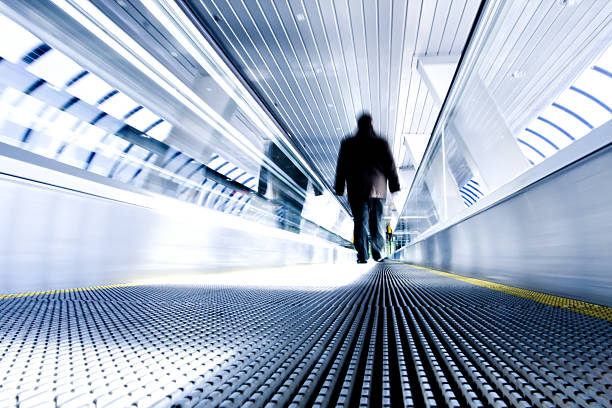 istock moving escalator in airport 530523563
