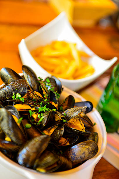 Mussels and french fries stock photo