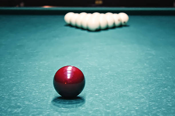 istock Billiards. Billiard balls on green table and white ball 530531435