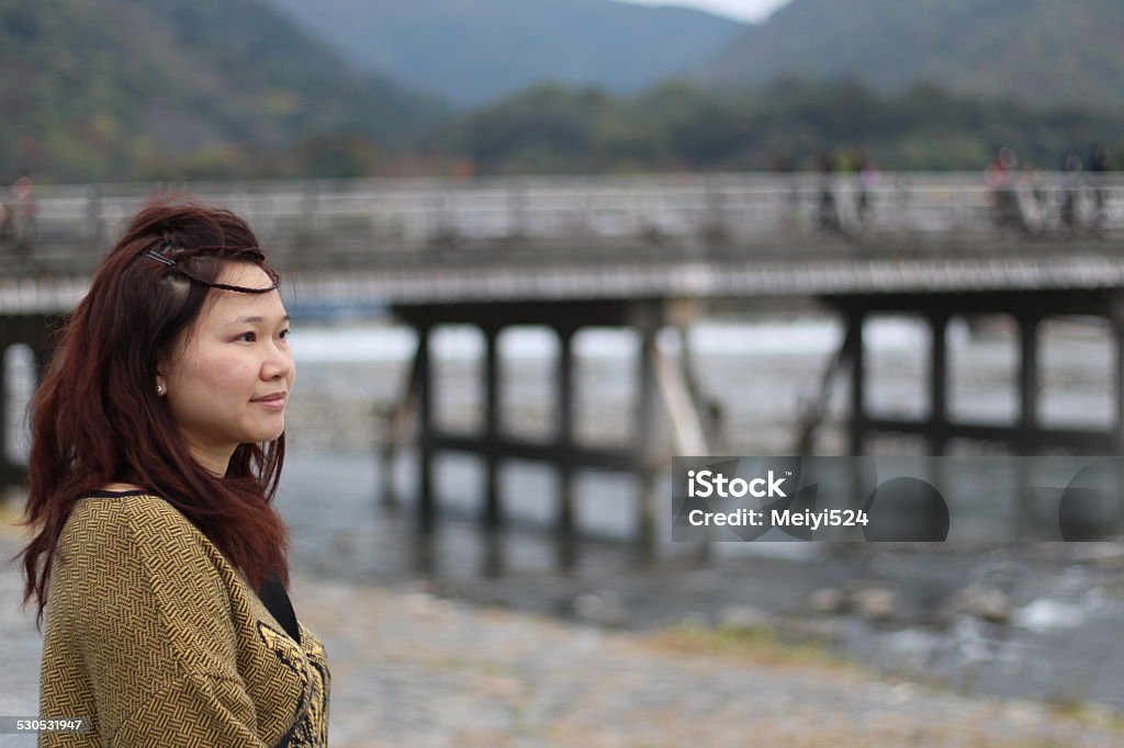 Woman Gazing at Beautiful Scene, Kyoto Woman is gazing at beautiful natural scene in Arashiyama Adult Stock Photo