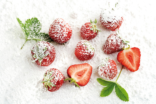 Strawberries with icing sugar, close-up