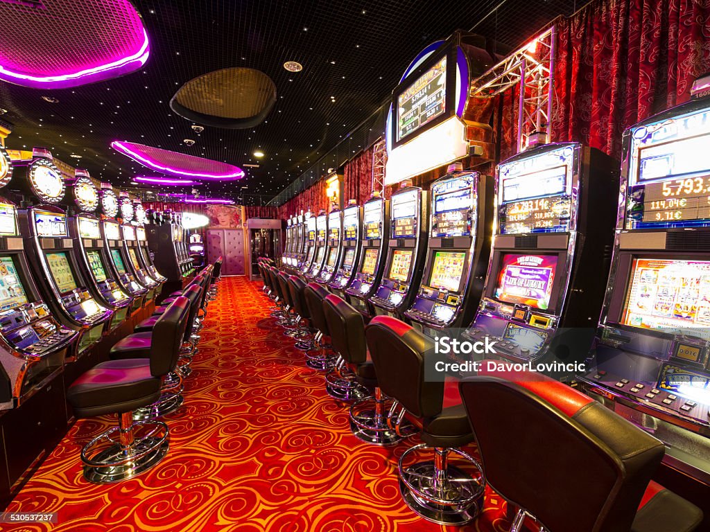 Slot Machines In Casino Stock Photo - Download Image Now - Casino, Slot  Machine, Backgrounds - iStock