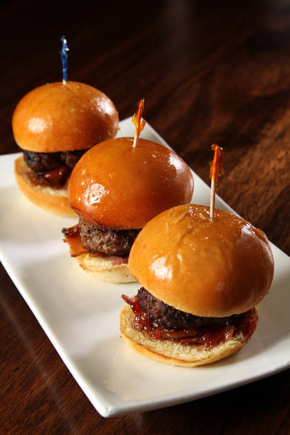 istock Gourmet hamburger sliders with bacon - vertical 530538073