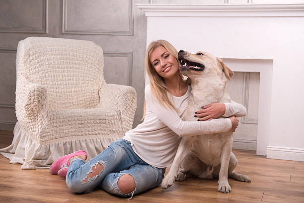istock Beautiful  blond girl with Labrador Retriever 530538239