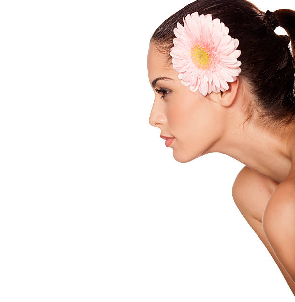 istock Profile of a beautiful girl with gerbera 530538257