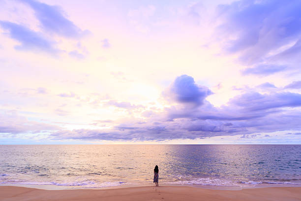 istock one women standing on soft cloud and sunset 530540353