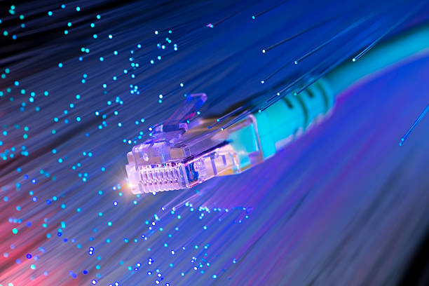 network cable with high tech technology color background network cable with high tech technology color background cable network connection plug computer cable internet stock pictures, royalty-free photos & images