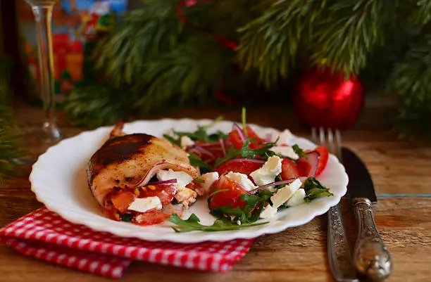 Grilled squid stuffed with feta, rocket and tomatoes and the same salad on the New Year's table.