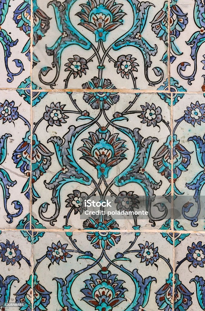 Arabic pattern shapes in mosaics Arabic pattern shapes in mosaics with many colors. Wall decoration with flowers and organic shapes. Arabia Stock Photo