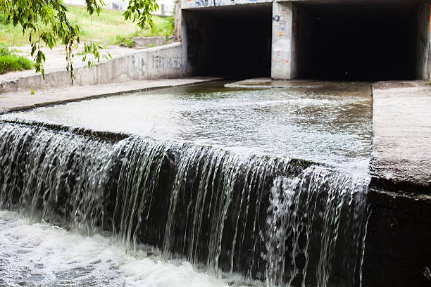 istock Water stream flowing out the underground tunnel 530552477