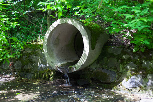 The run-off pipe discharging water stock photo