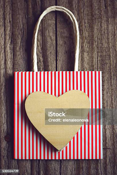 Gift On A Wooden Background Stock Photo - Download Image Now - Art And Craft, Backgrounds, Bag