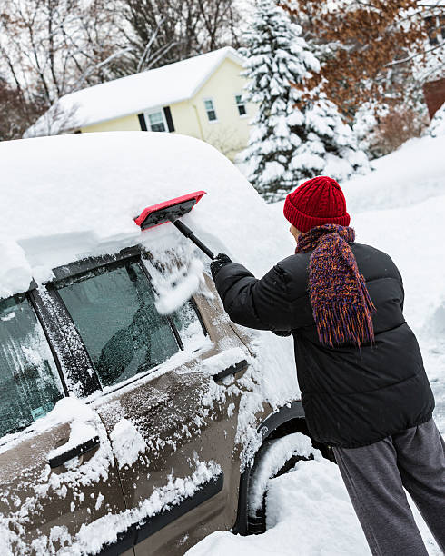 istock Deep Snow Scraped Off Car By Winter Woman 530556343