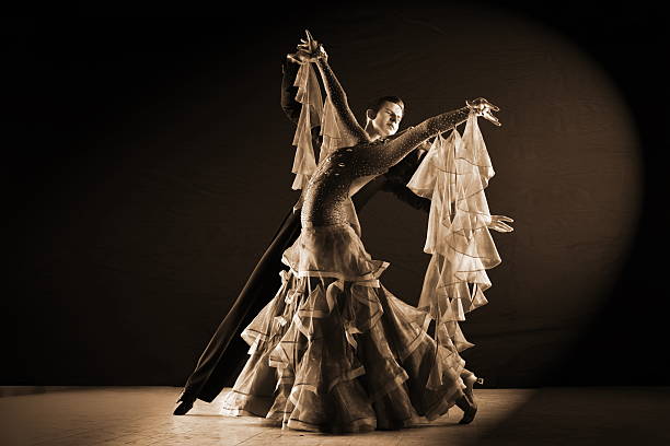 istock dancers in ballroom isolated on black background 530556695