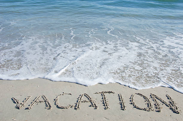 istock Beach Vacation Written in the Sand 530557779